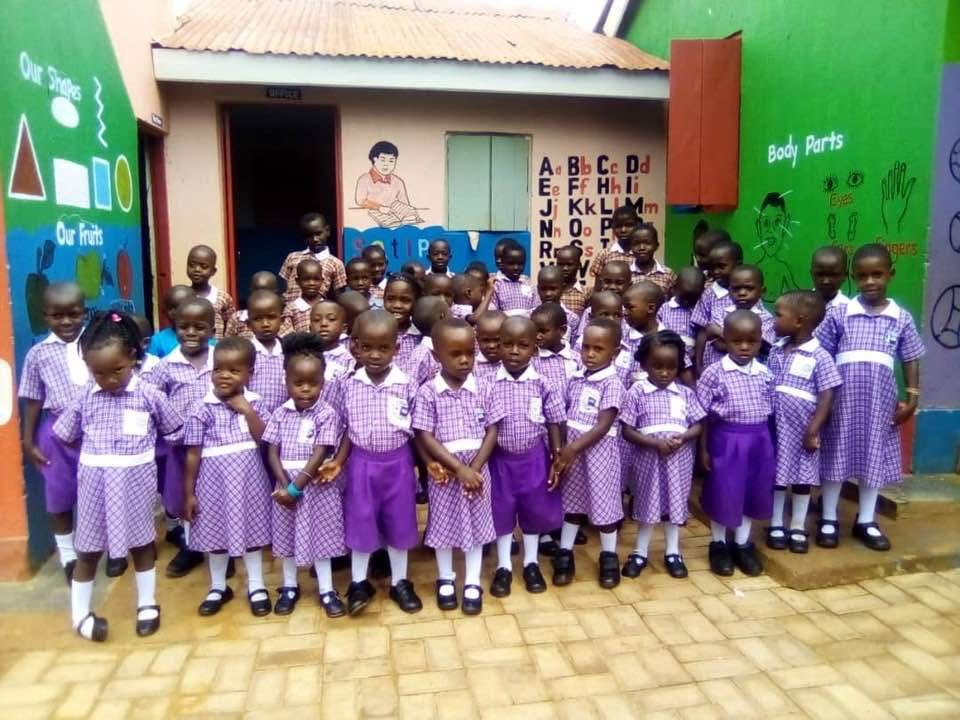 Young learners in purple uniform at the nursery and primary school