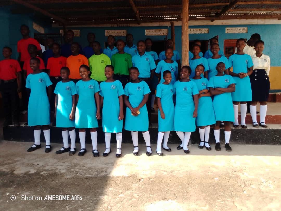 Secondary school students standing together in uniform